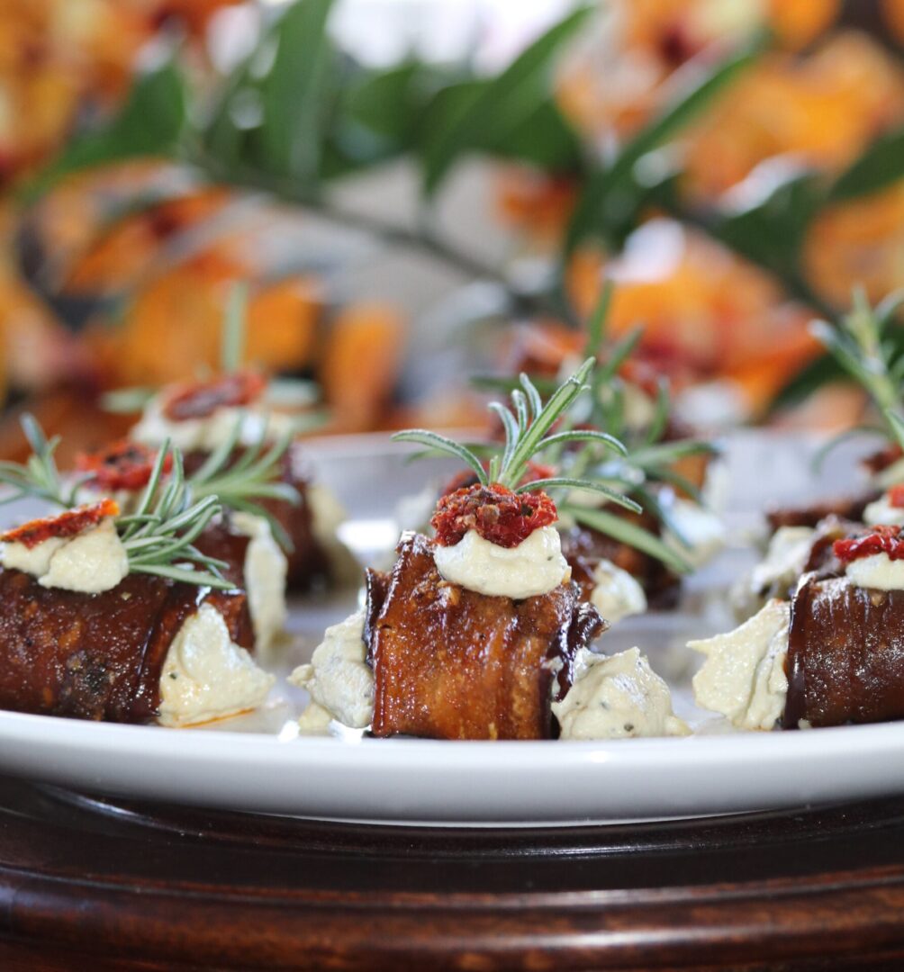 Rosemary Eggplant Roll Dish Plated WIth Sauce
